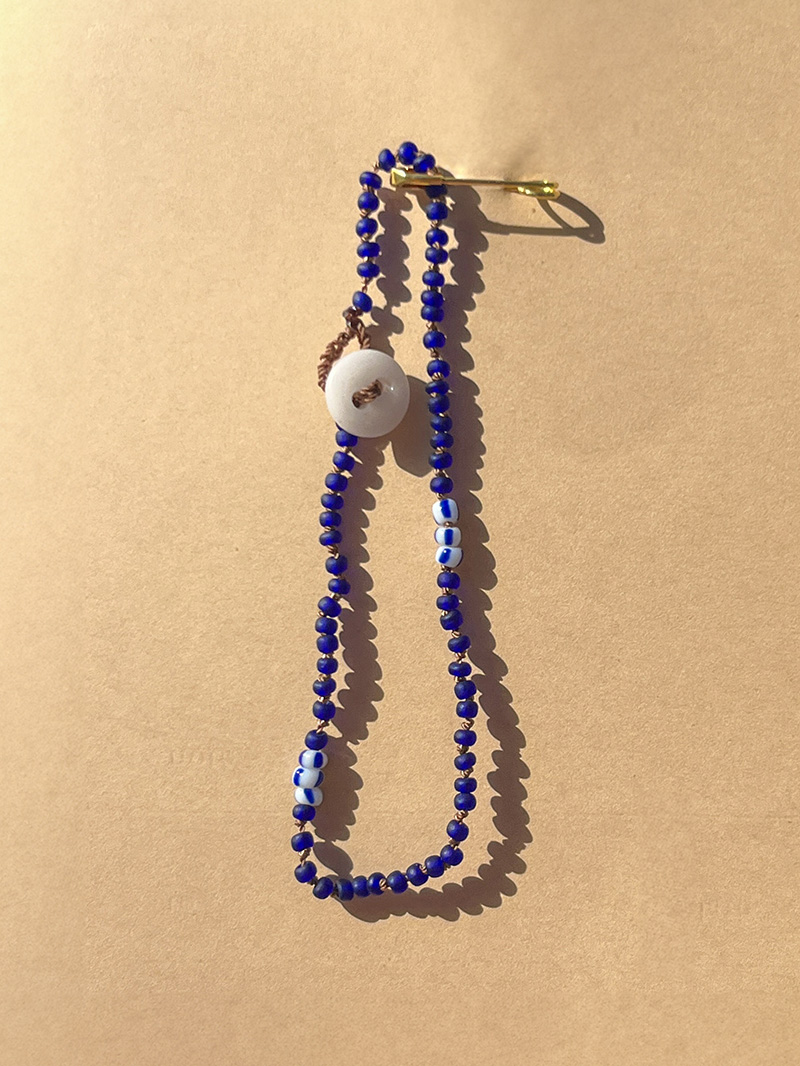 Hand-knotted bracelet vintage glass beads vintage glass button closure