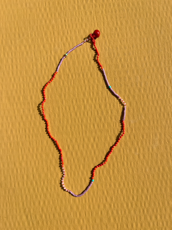 Hand-knotted necklace vintage glass beads vintage blood coral bead closure model packshot