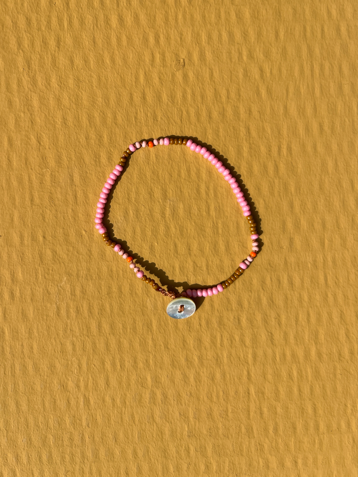 Hand-knotted bracelet vintage glass beads vintage peach bead closure model packshot