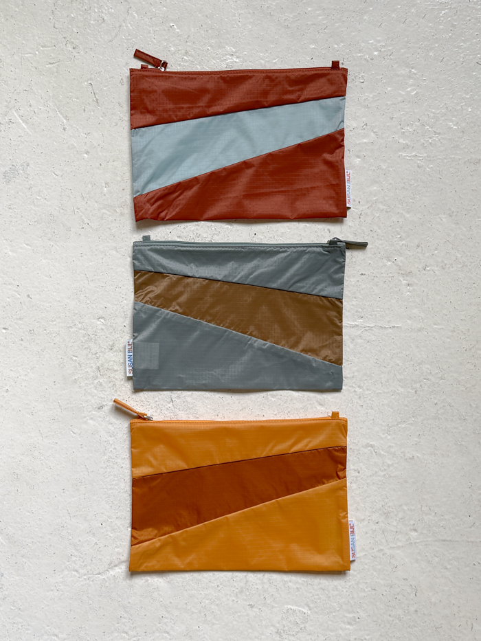the new pouch medium susan bijl riptop sustainable fabric waterproof cinnamon grey calendula & ginger grey camel